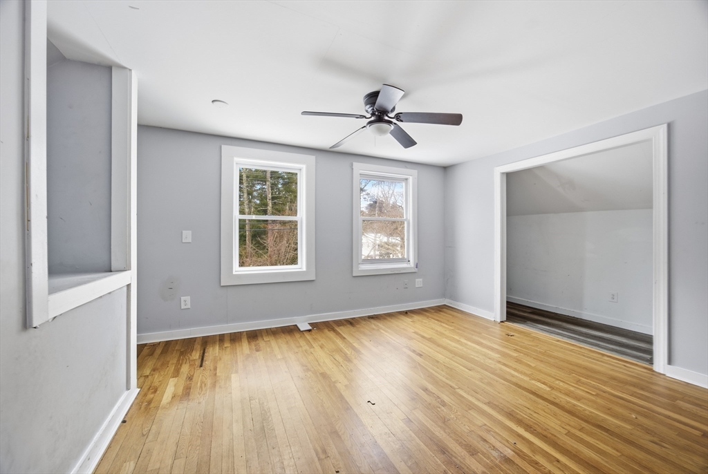 2230 Cranberry Highway, Unit A Wareham, MA 02576 - Photo 24 of 25 a view of room with window ceiling fan and wooden floor