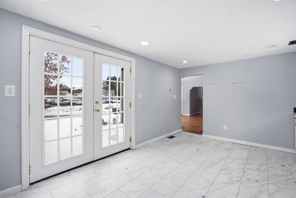 2230 Cranberry Highway, Unit A Wareham, MA 02576 - Photo 5 of 25 a view of an empty room with a window