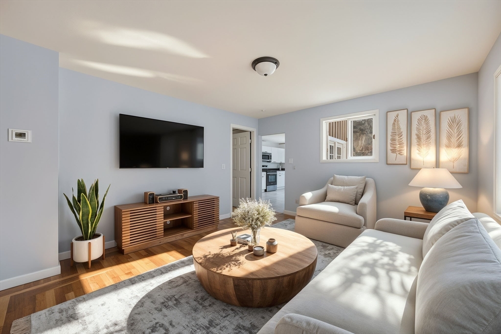 2230 Cranberry Highway, Unit A Wareham, MA 02576 - Photo 7 of 25 a living room with furniture and a flat screen tv