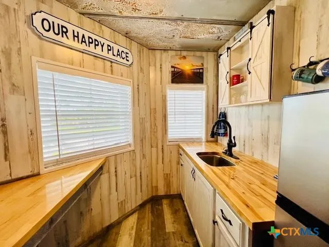 a kitchen with a sink and a window