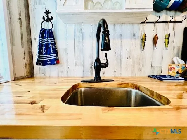 a bathroom with a sink and mirror