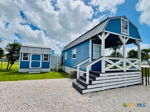 a house view with a garden space