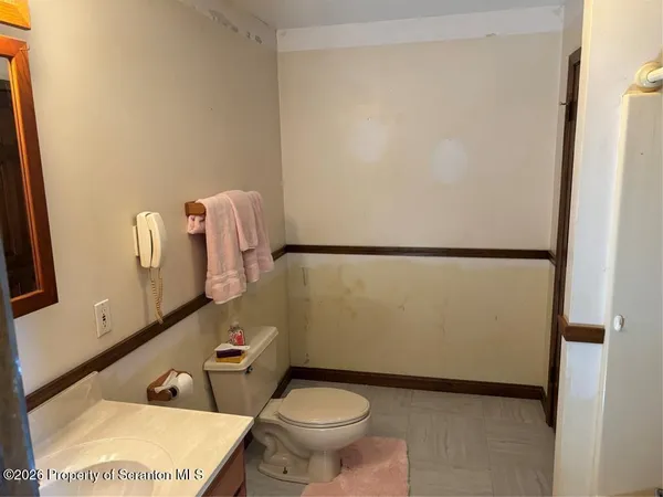 a bathroom with a toilet and a sink