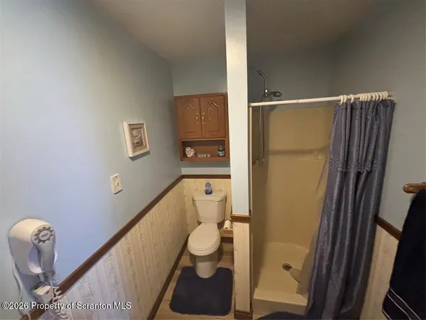 a bathroom with a tub and a shower