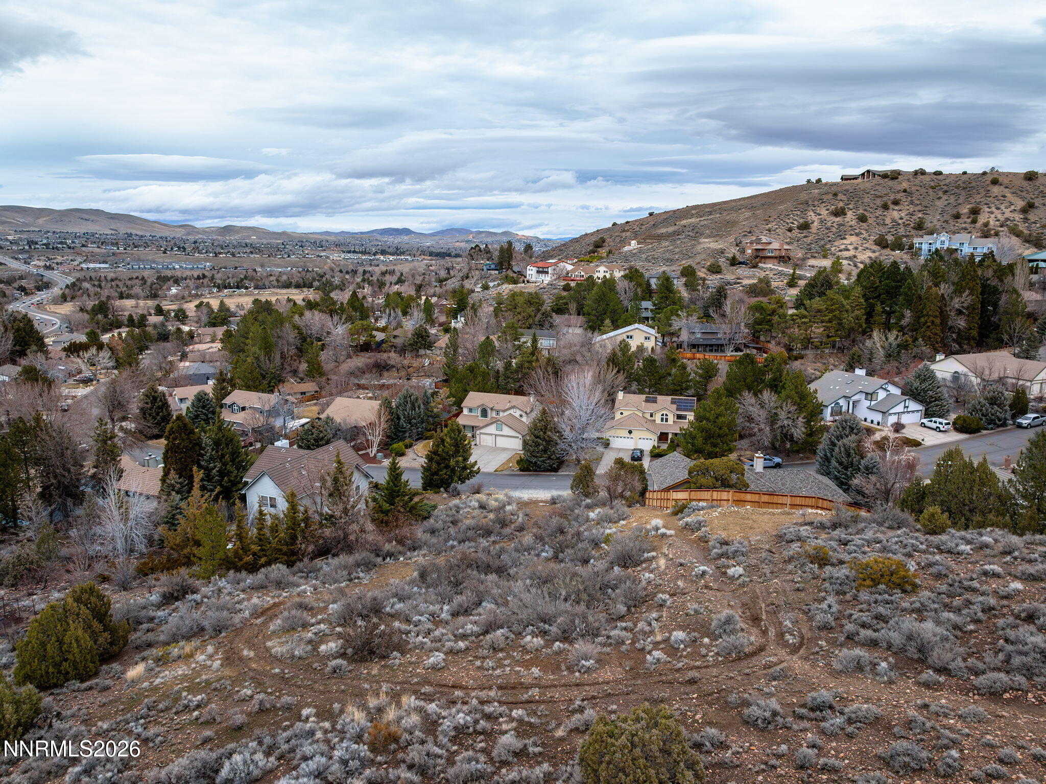 3300 Thornhill Drive Reno, NV 89509 - Photo 5 of 8 a view of a city with mountains in the background