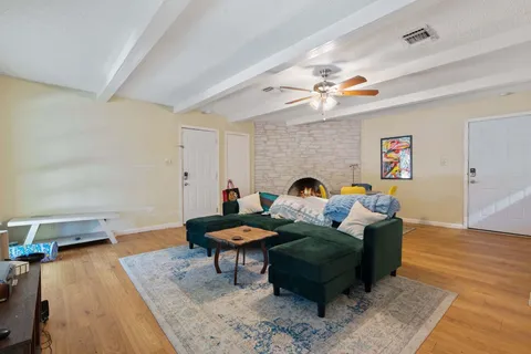 a living room with furniture and a rug
