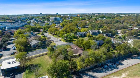 an aerial view of multiple house with outdoor space