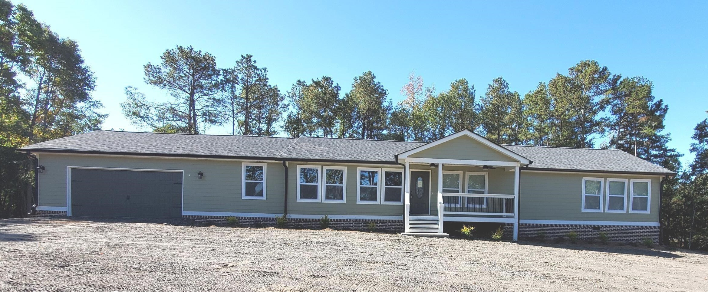 4107 Maroney Mill Road Douglasville, GA 30134 - Photo 1 of 1 a front view of a house with a garden