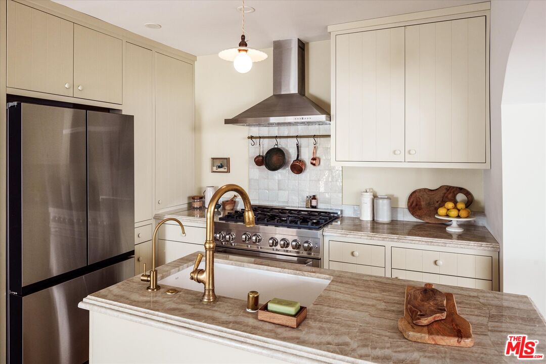 1410 Stanford Drive Glendale, CA 91205 - Photo 14 of 31 a kitchen with a stove and cabinets