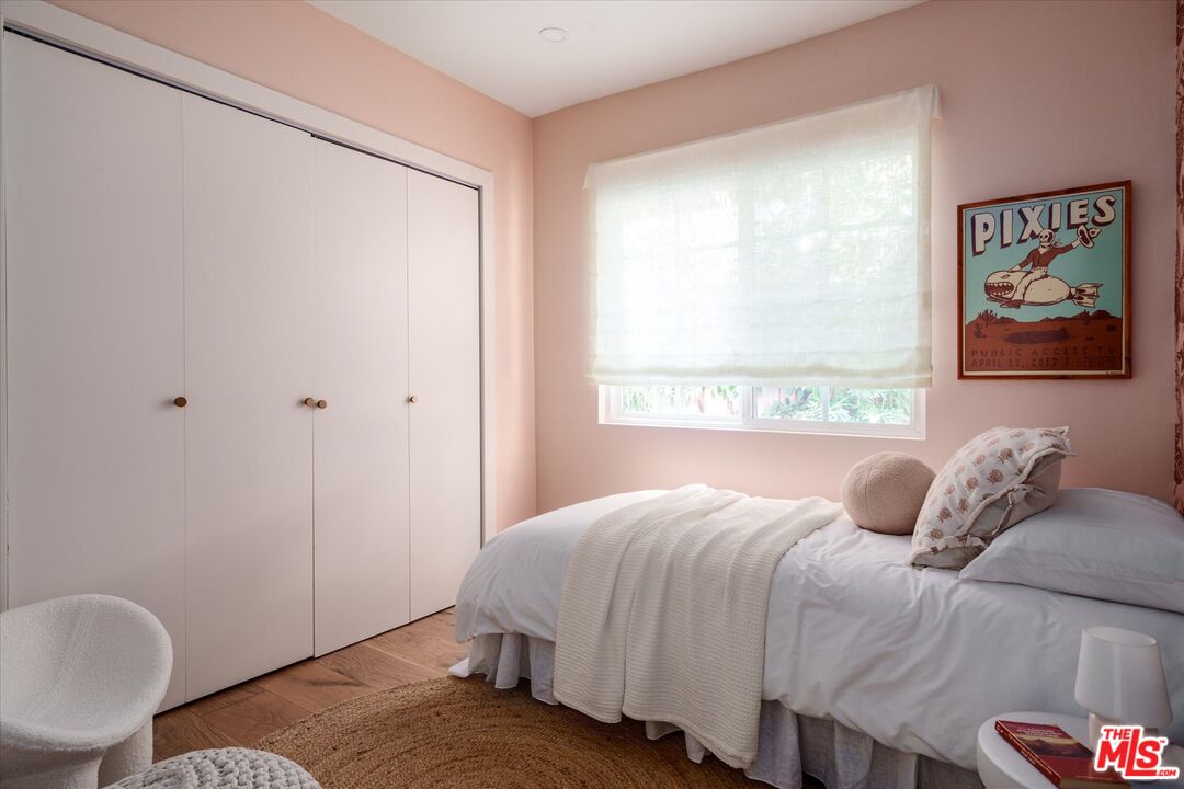 1410 Stanford Drive Glendale, CA 91205 - Photo 20 of 31 a bedroom with a bed and painting on the wall
