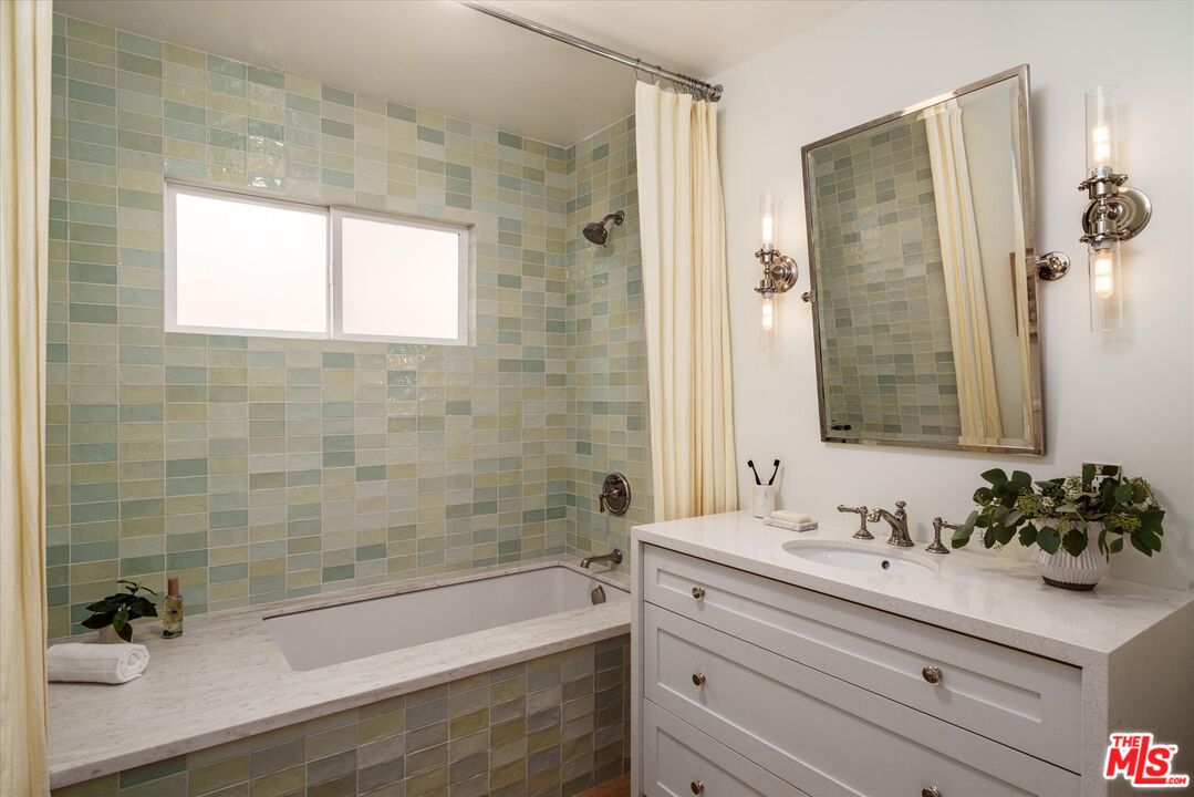 1410 Stanford Drive Glendale, CA 91205 - Photo 22 of 31 a bathroom with a bathtub shower sink and mirror