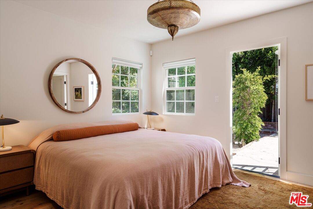 1410 Stanford Drive Glendale, CA 91205 - Photo 23 of 31 a bedroom with a large bed and a large window