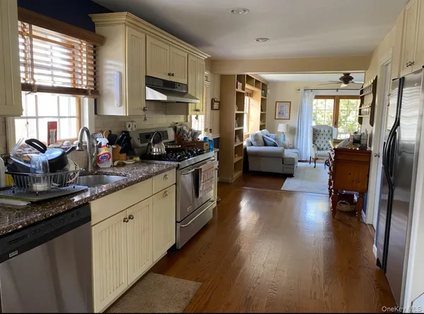 a view of a dining room with furniture and window