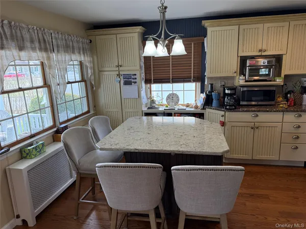 a kitchen with counter top space a sink and appliances