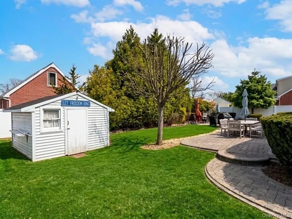 a view of a house with swimming pool and sitting area