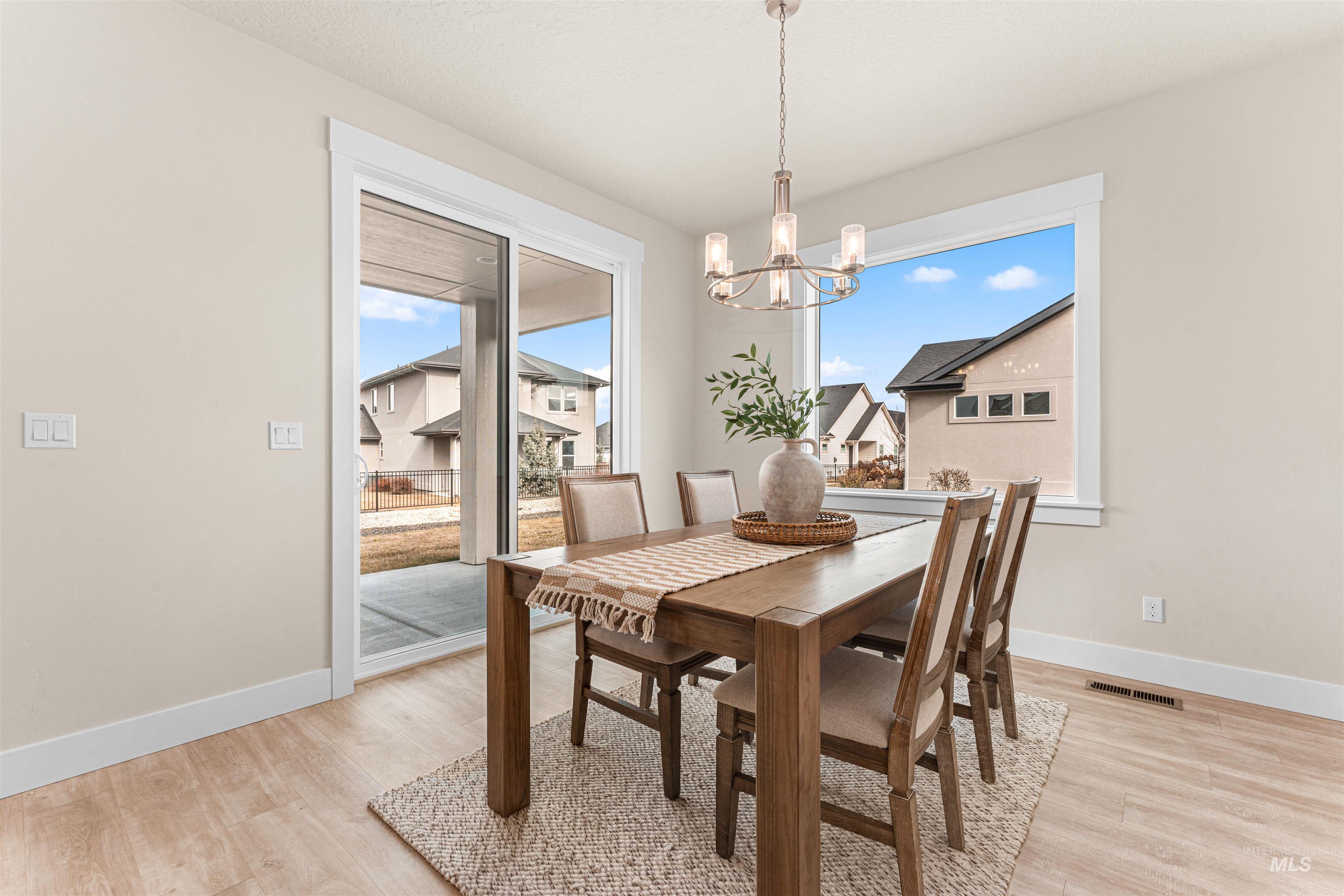 8082 Tandy Cv Street Middleton, ID 83644 - Photo 14 of 37 Dining space featuring suspended lighting and light wood-type flooring