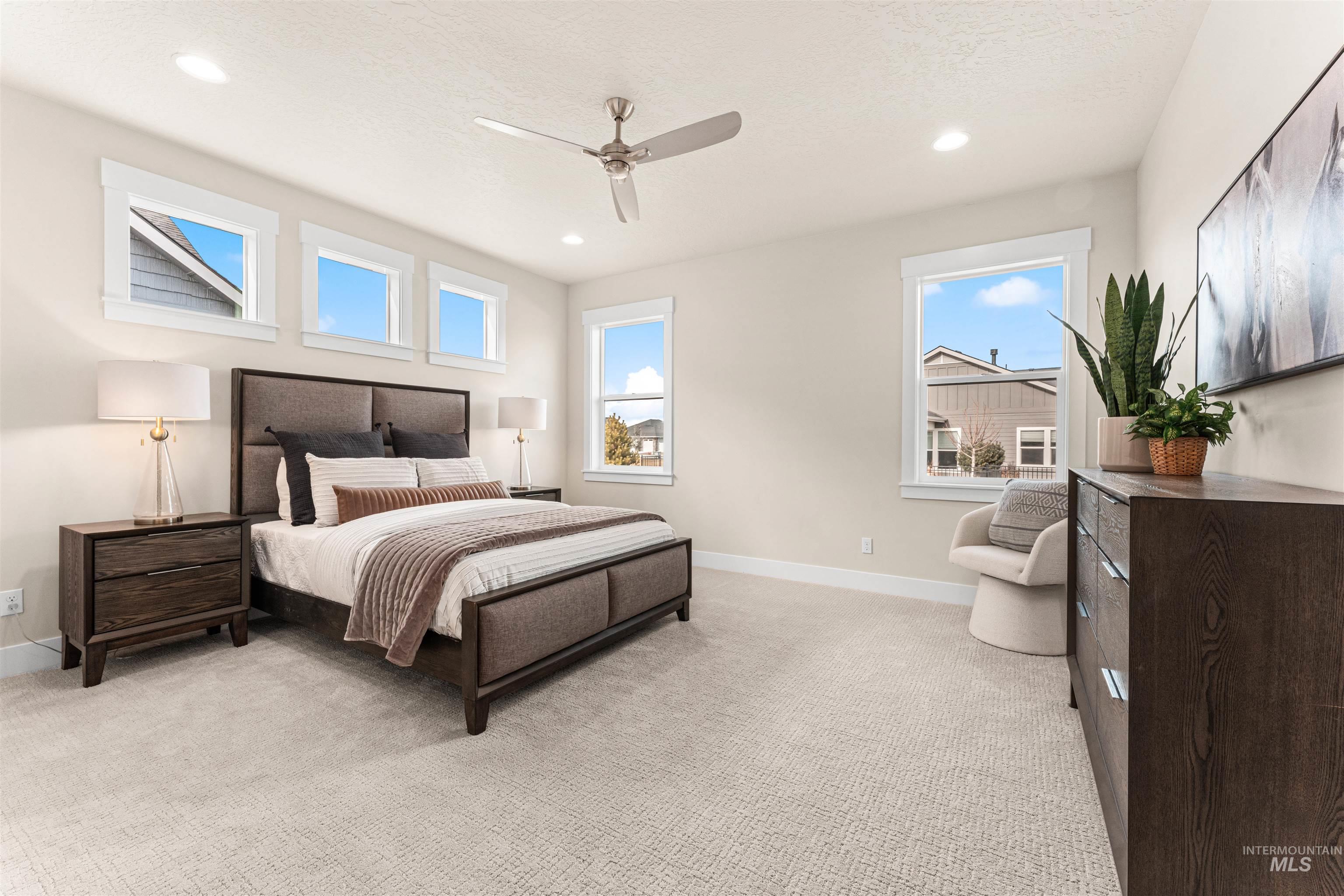 8082 Tandy Cv Street Middleton, ID 83644 - Photo 16 of 37 Bedroom with light colored carpet, ceiling fan, and recessed lighting