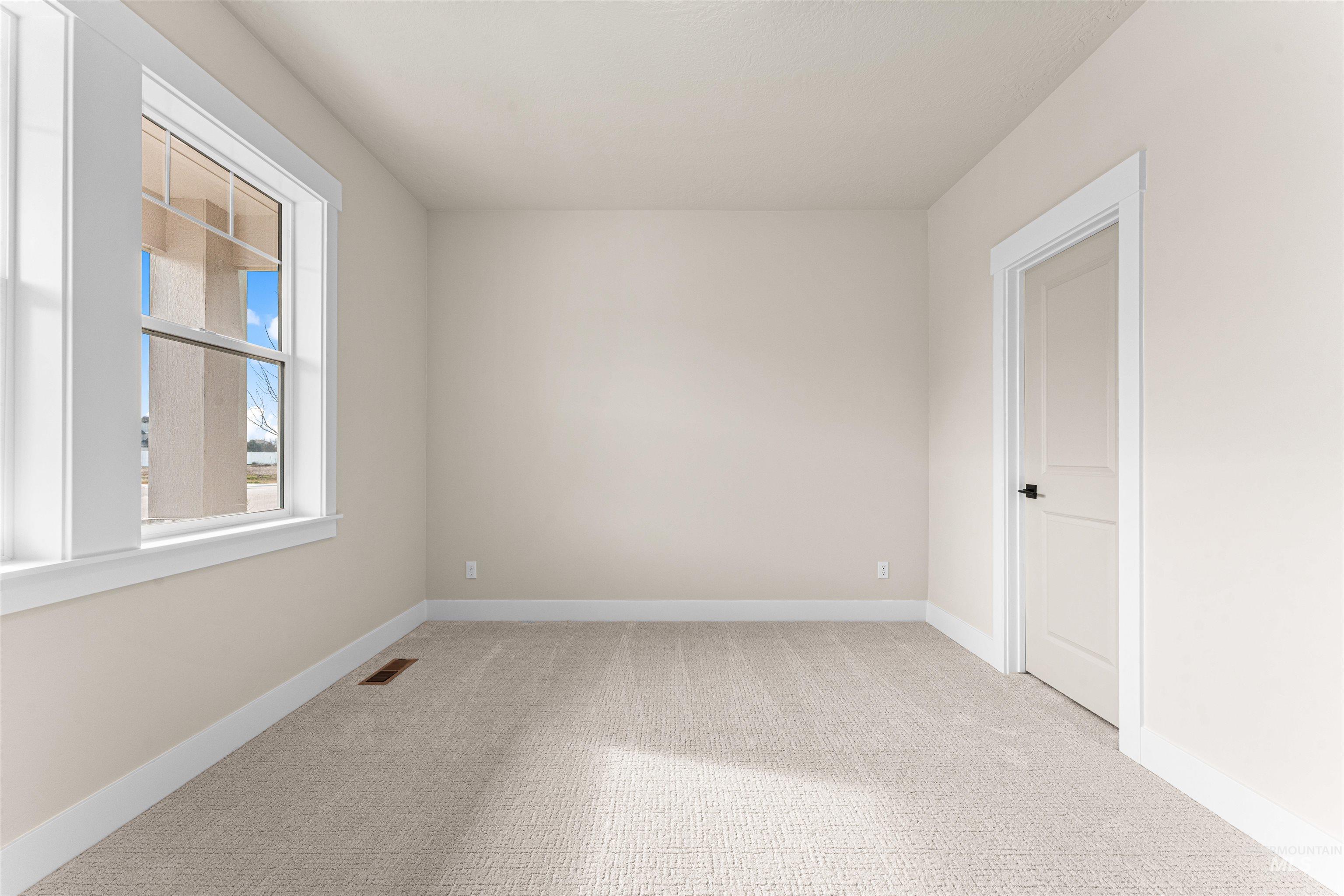 8082 Tandy Cv Street Middleton, ID 83644 - Photo 23 of 37 Empty room with light colored carpet and baseboards