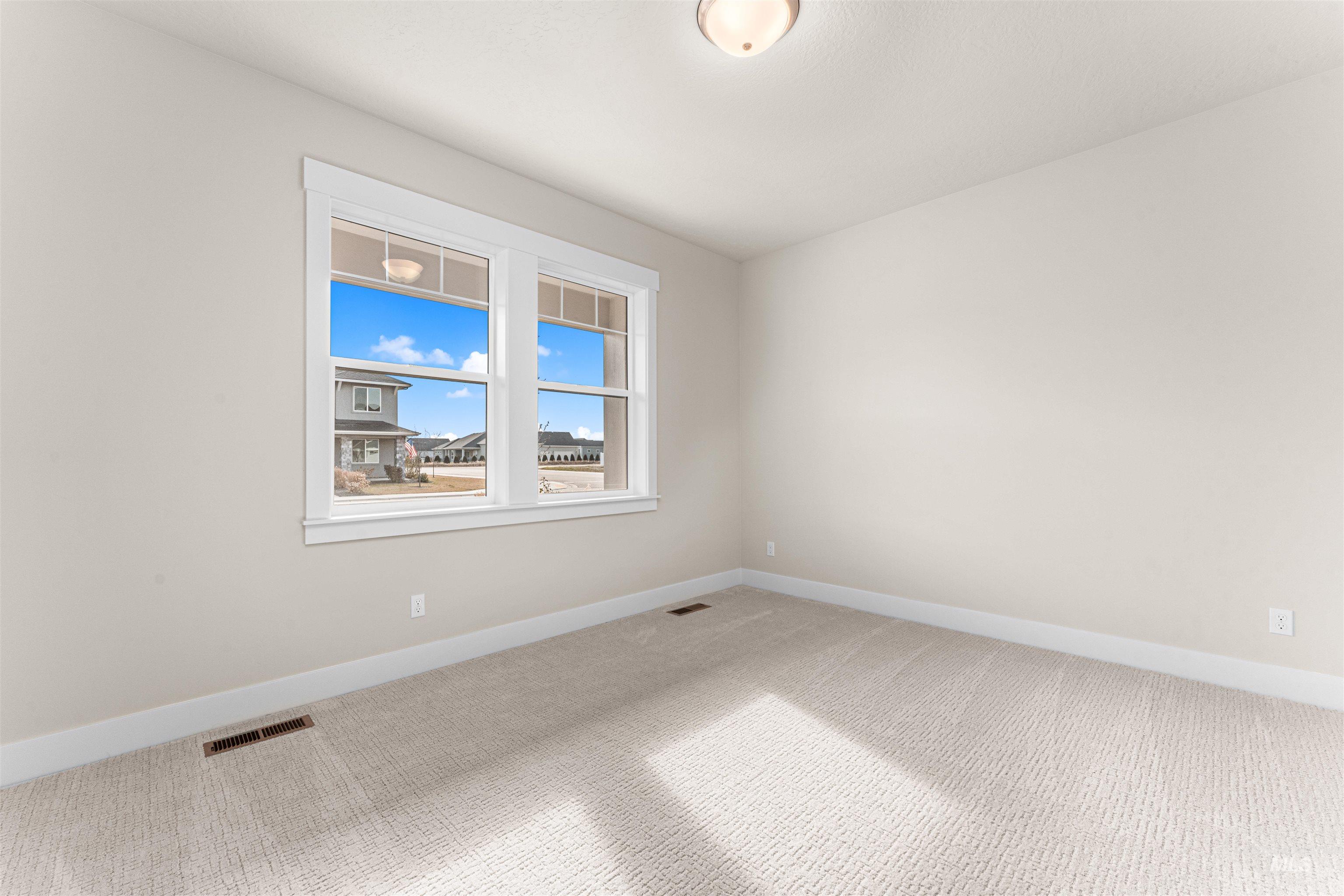8082 Tandy Cv Street Middleton, ID 83644 - Photo 24 of 37 Carpeted spare room with baseboards