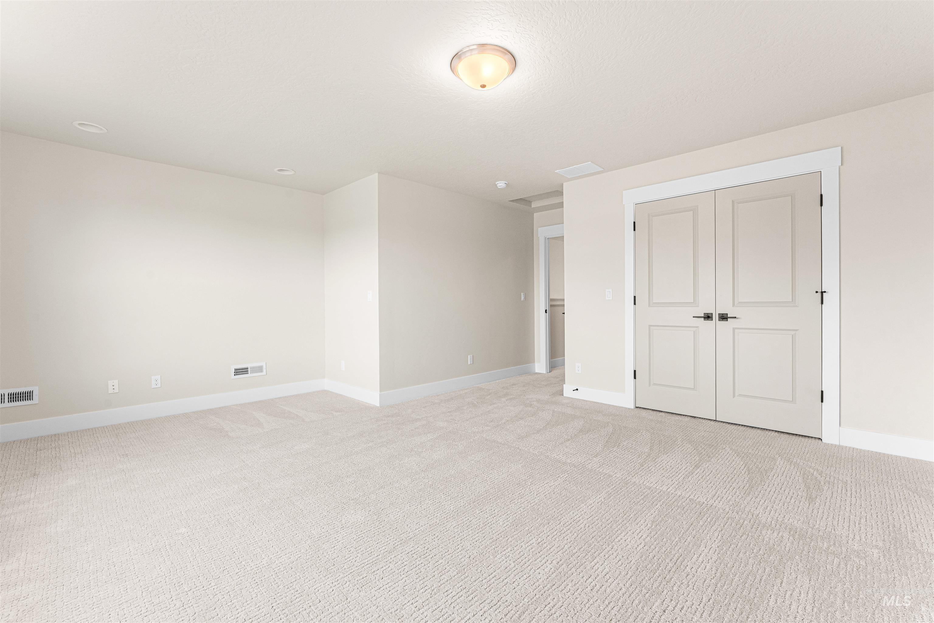 8082 Tandy Cv Street Middleton, ID 83644 - Photo 32 of 37 Unfurnished bedroom with light carpet and a closet