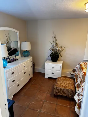 a bedroom with a bed and a dresser
