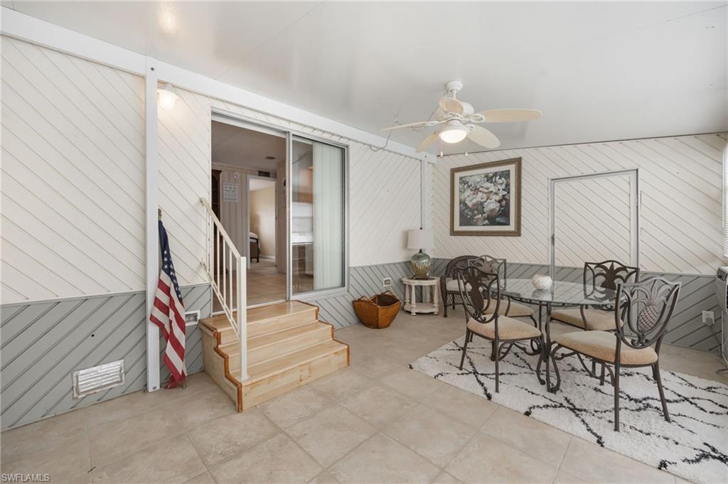 21 San Lu Rue Avenue, Unit 21 Naples, FL 34104 - Photo 22 of 33 a view of a livingroom with furniture and white walls