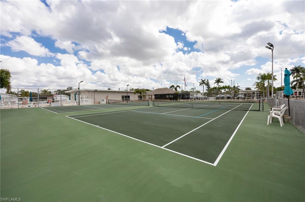 21 San Lu Rue Avenue, Unit 21 Naples, FL 34104 - Photo 28 of 33 a view of a tennis court