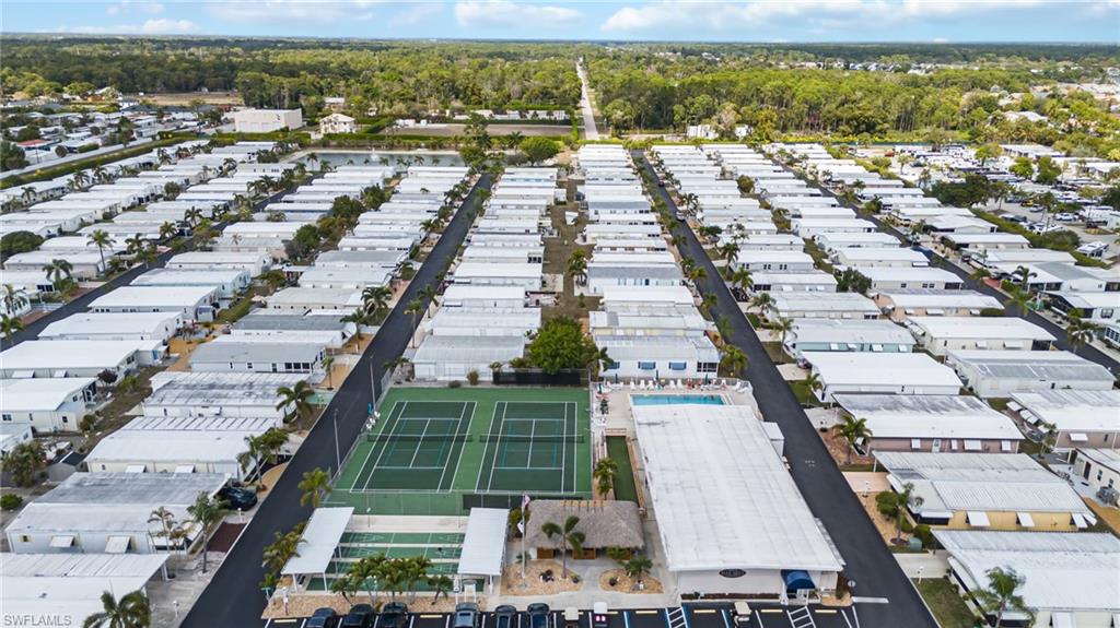 21 San Lu Rue Avenue, Unit 21 Naples, FL 34104 - Photo 33 of 33 an aerial view of residential houses with outdoor space