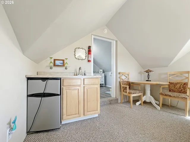 a view of a livingroom with furniture and a potted plant