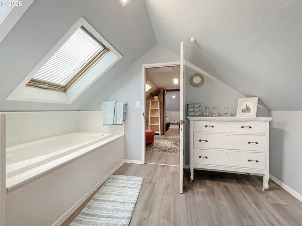 a bathroom with a sink toilet and mirror