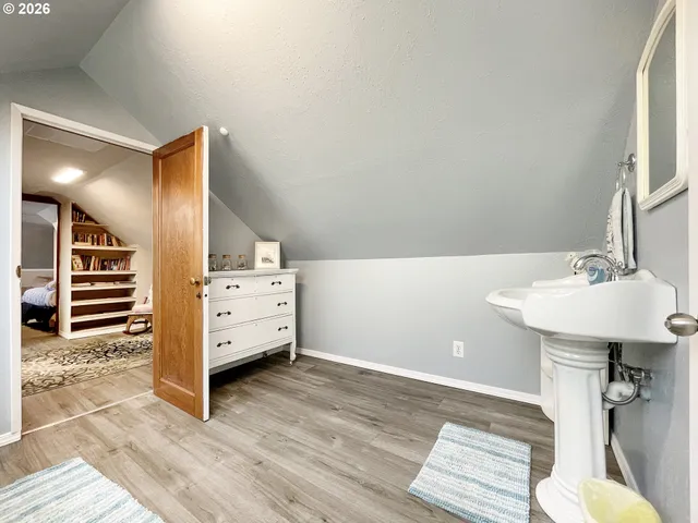 a view of living room with furniture and wooden floor