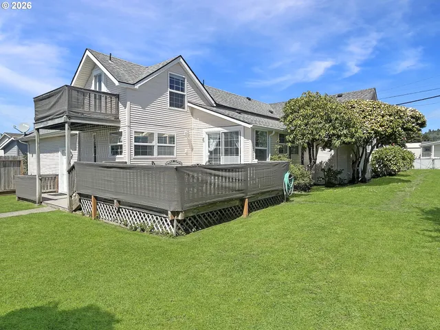 a view of wooden door and a wooden deck