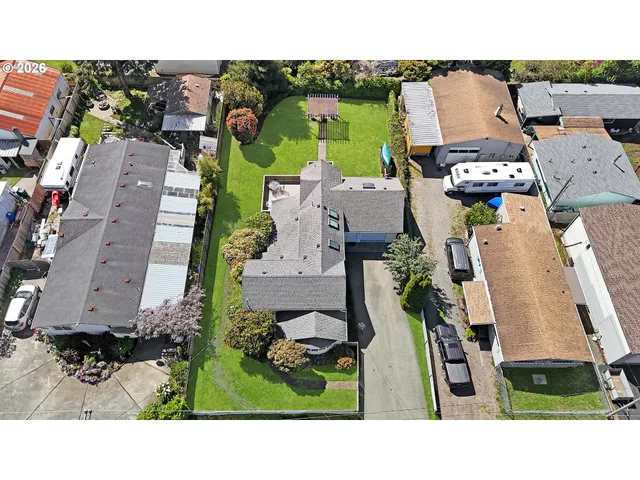 an aerial view of a house with a garden