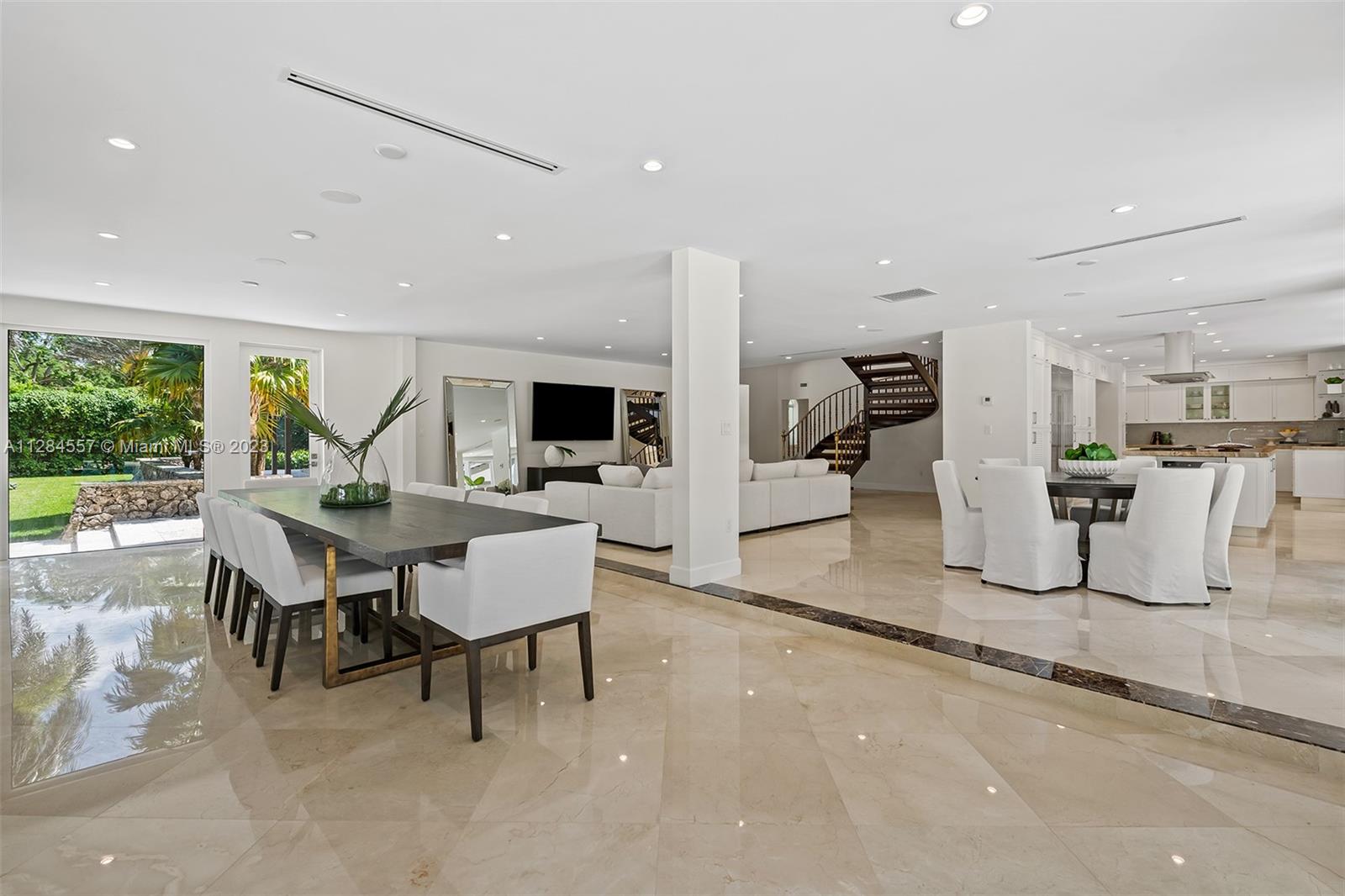 4845 Davis Road Miami, FL 33143 - Photo 11 of 34 a dining room with furniture and a large window
