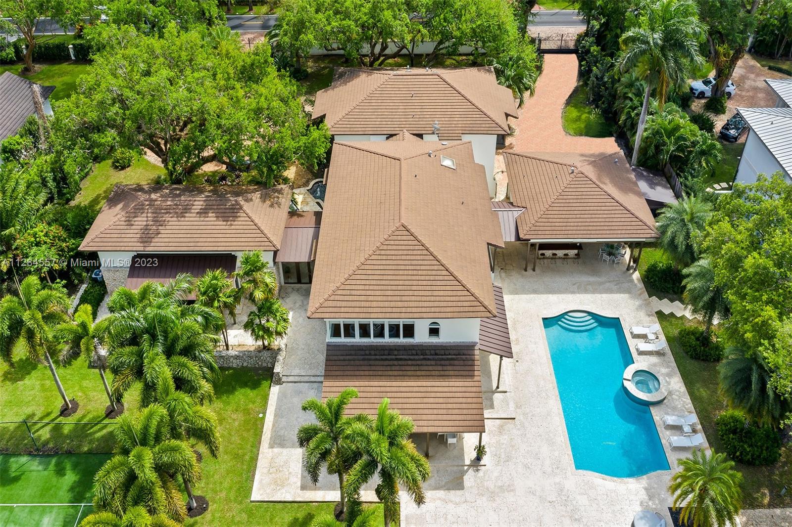 4845 Davis Road Miami, FL 33143 - Photo 2 of 34 an aerial view of a house with garden space and street view