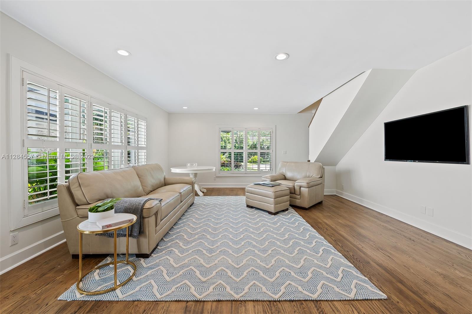 4845 Davis Road Miami, FL 33143 - Photo 24 of 34 a living room with furniture and a flat screen tv