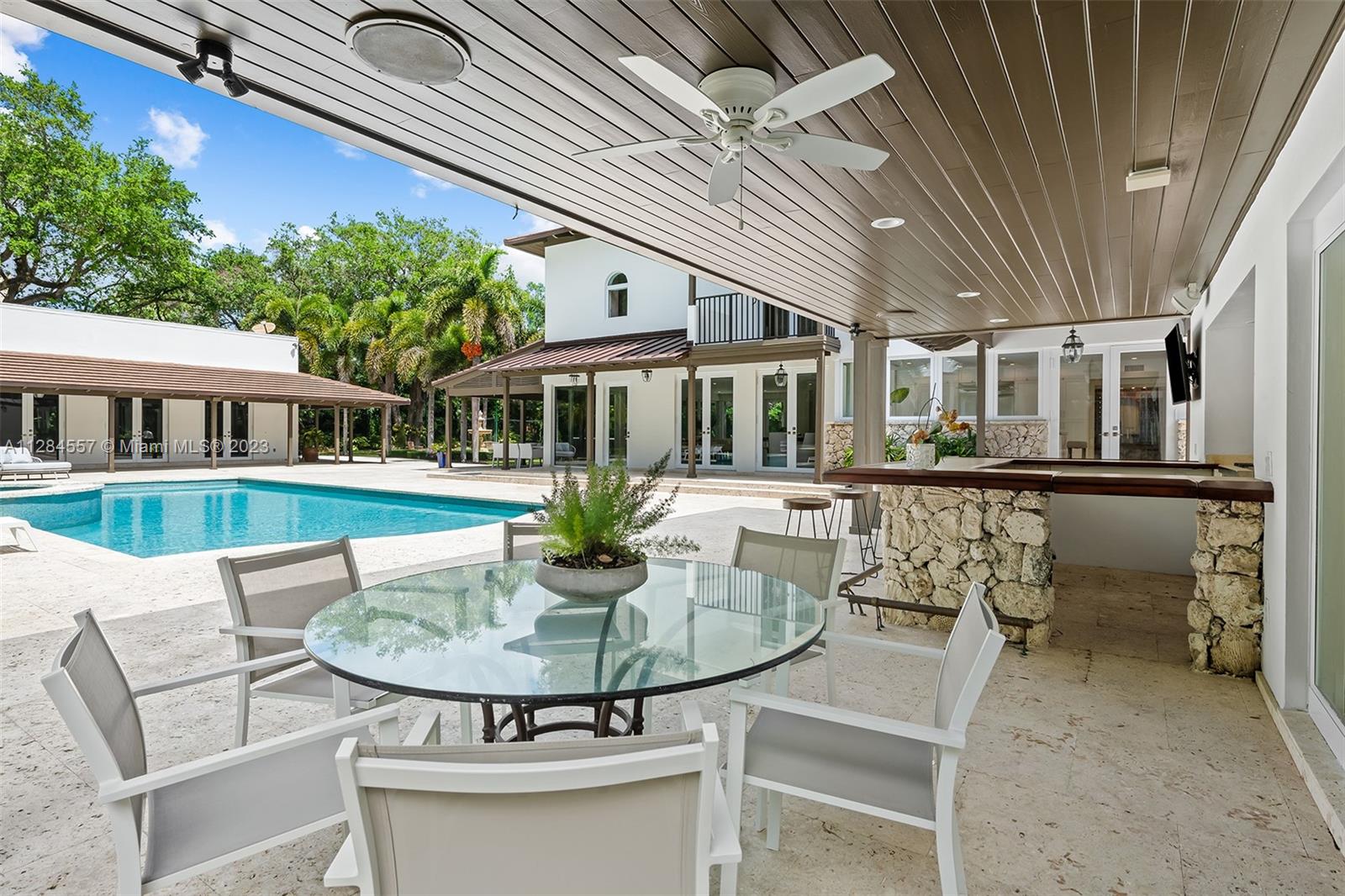 4845 Davis Road Miami, FL 33143 - Photo 27 of 34 a view of a house with backyard outdoor seating area and furniture