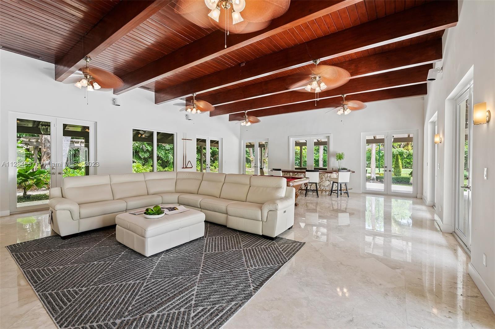 4845 Davis Road Miami, FL 33143 - Photo 32 of 34 a living room with furniture and white walls