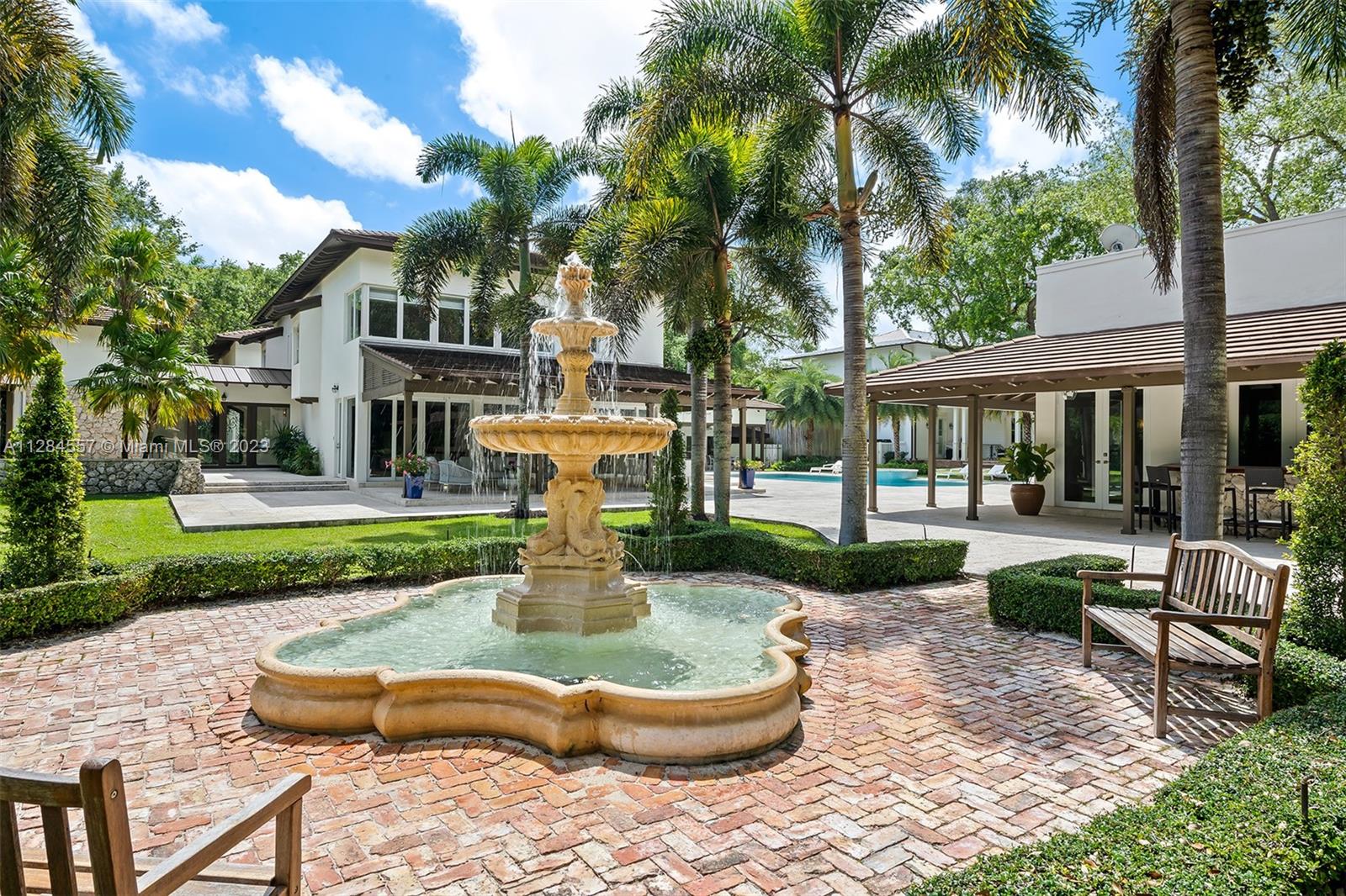 4845 Davis Road Miami, FL 33143 - Photo 34 of 34 a front view of a house with garden and patio