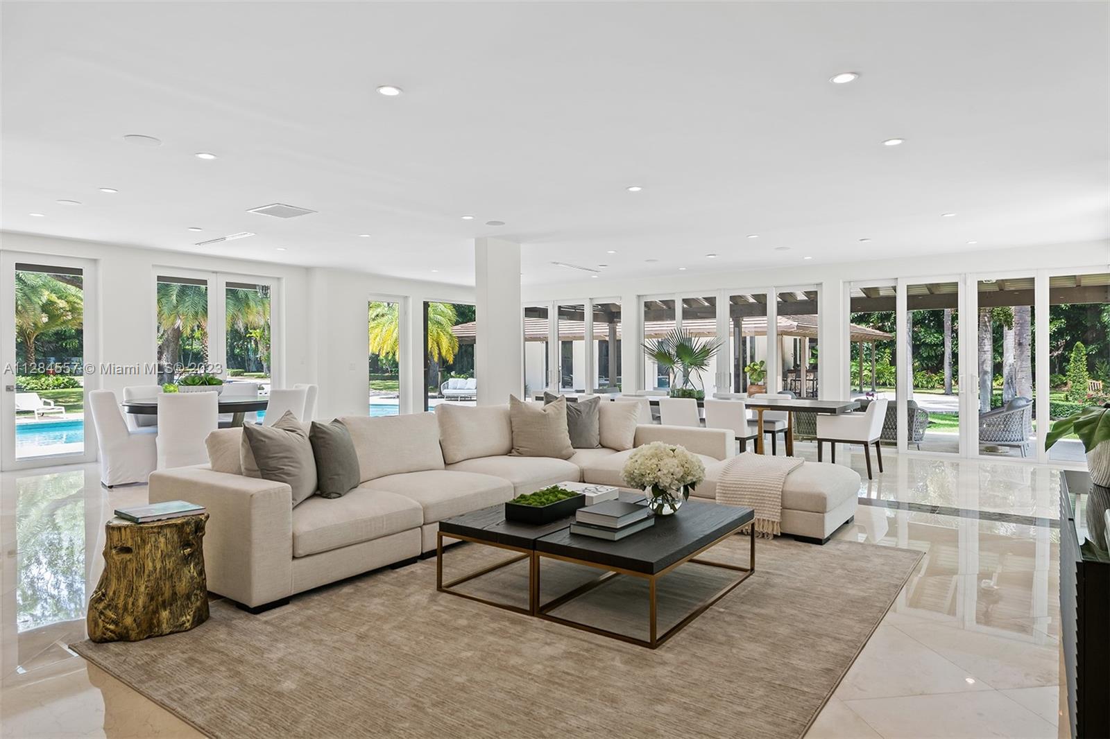 4845 Davis Road Miami, FL 33143 - Photo 9 of 34 a living room with furniture and a large window
