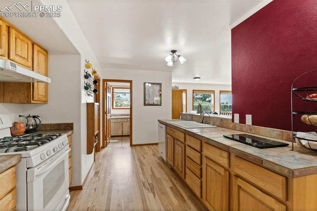 64 Highland Road Palmer Lake, CO 80133 - Photo 22 of 45 Plenty of Hand Made Wood Cabinets!