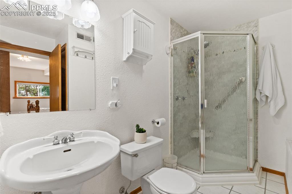 64 Highland Road Palmer Lake, CO 80133 - Photo 30 of 45 Full Master Bathroom with Separate Shower and Large Jetted Soaking Tub!