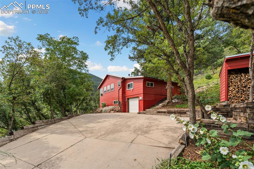 64 Highland Road Palmer Lake, CO 80133 - Photo 40 of 45 Long Drive Way to this One-of-a-Kind Mountain Escape!