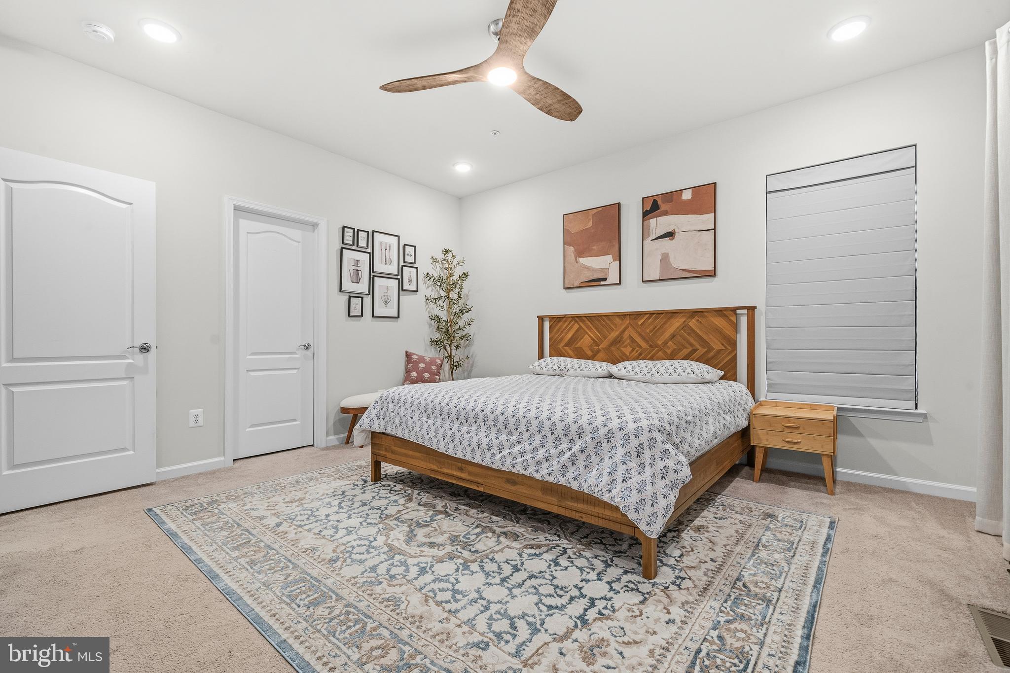 7715 Cresap Lane Hanover, MD 21076 - Photo 21 of 42 a bedroom with a bed and a chandelier