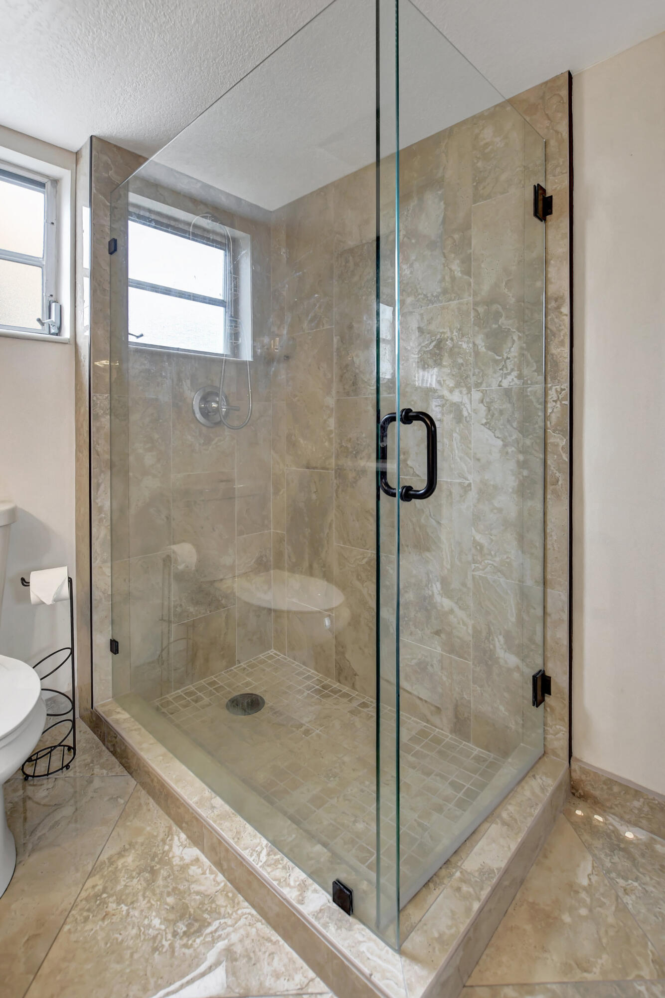 9810 Marina Boulevard, Unit 1120 Boca Raton, FL 33428 - Photo 17 of 29 a bathroom with a shower