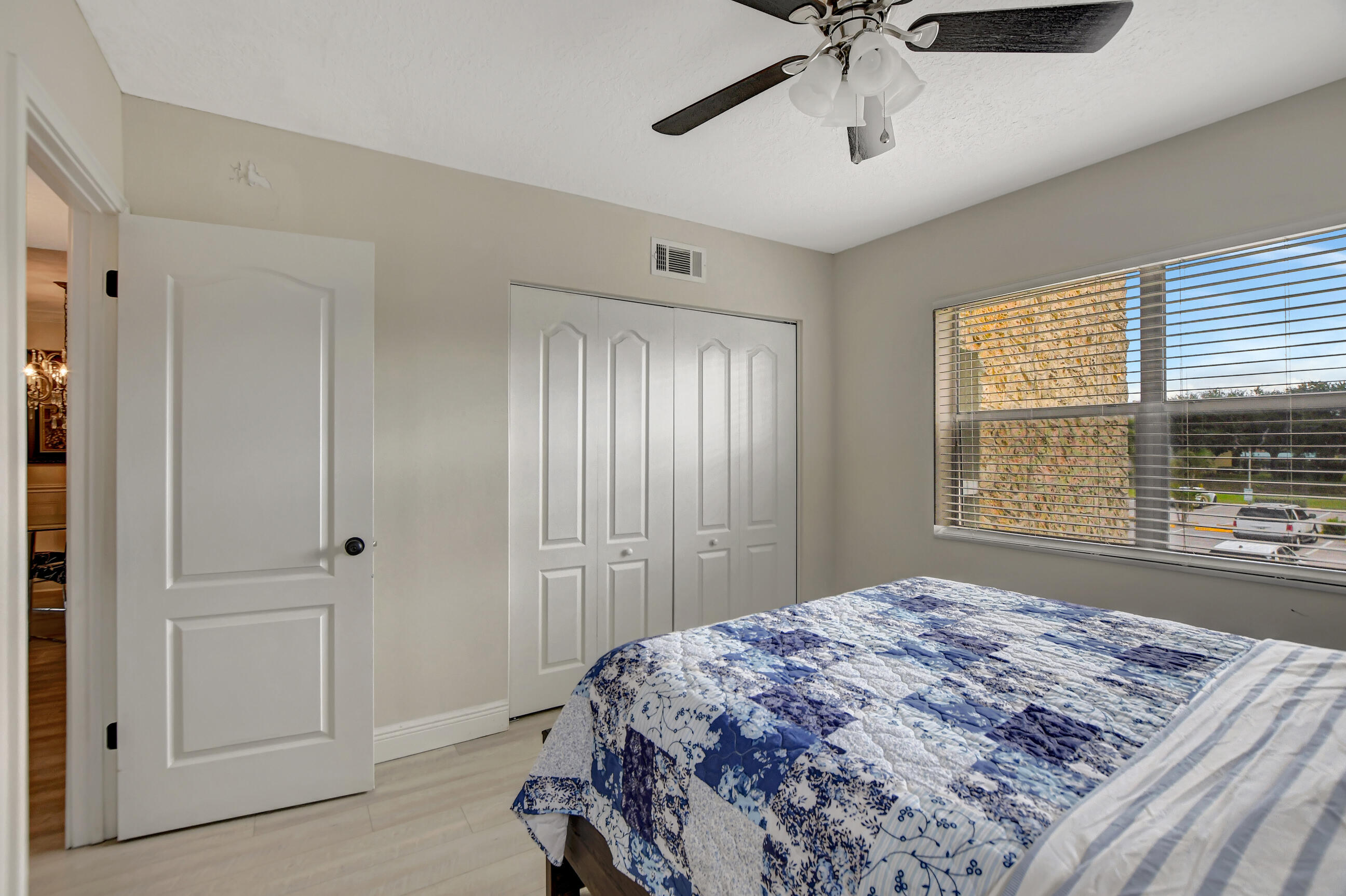 9810 Marina Boulevard, Unit 1120 Boca Raton, FL 33428 - Photo 20 of 29 a bedroom with a bed and a window