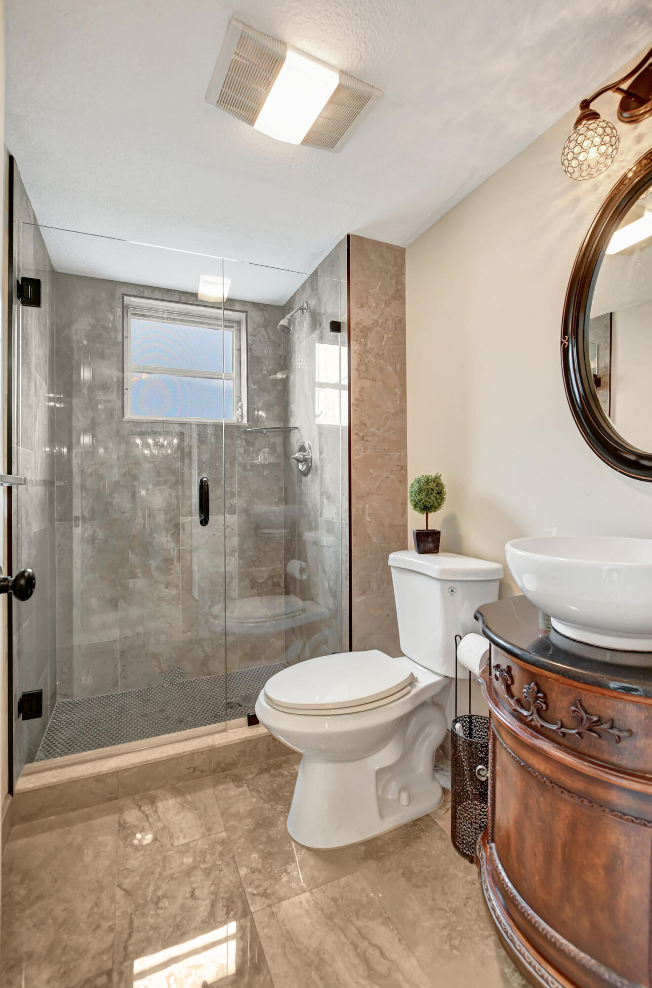 9810 Marina Boulevard, Unit 1120 Boca Raton, FL 33428 - Photo 22 of 29 a bathroom with a toilet and a shower