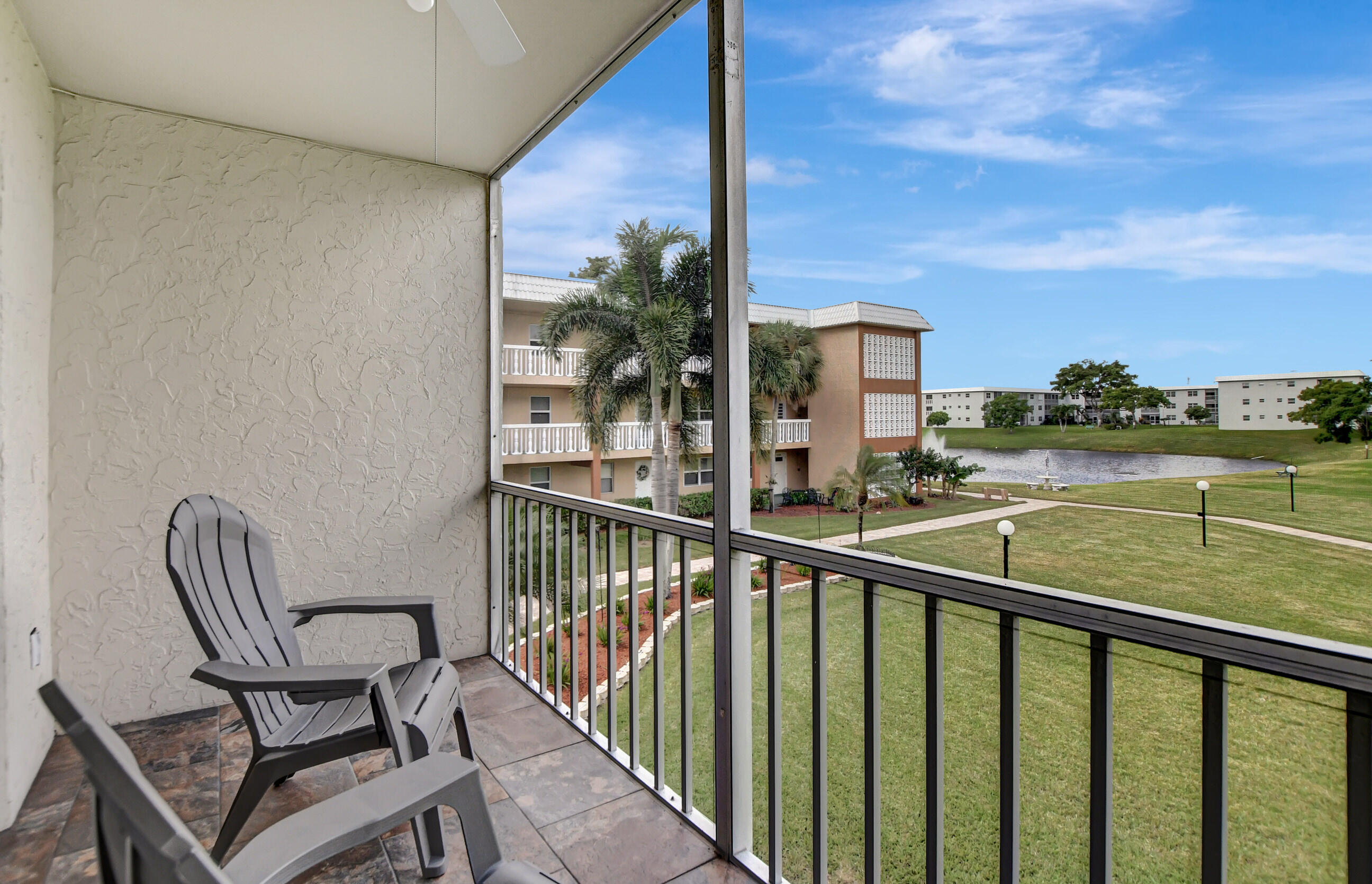 9810 Marina Boulevard, Unit 1120 Boca Raton, FL 33428 - Photo 25 of 29 a view of a chair and tables in the balcony