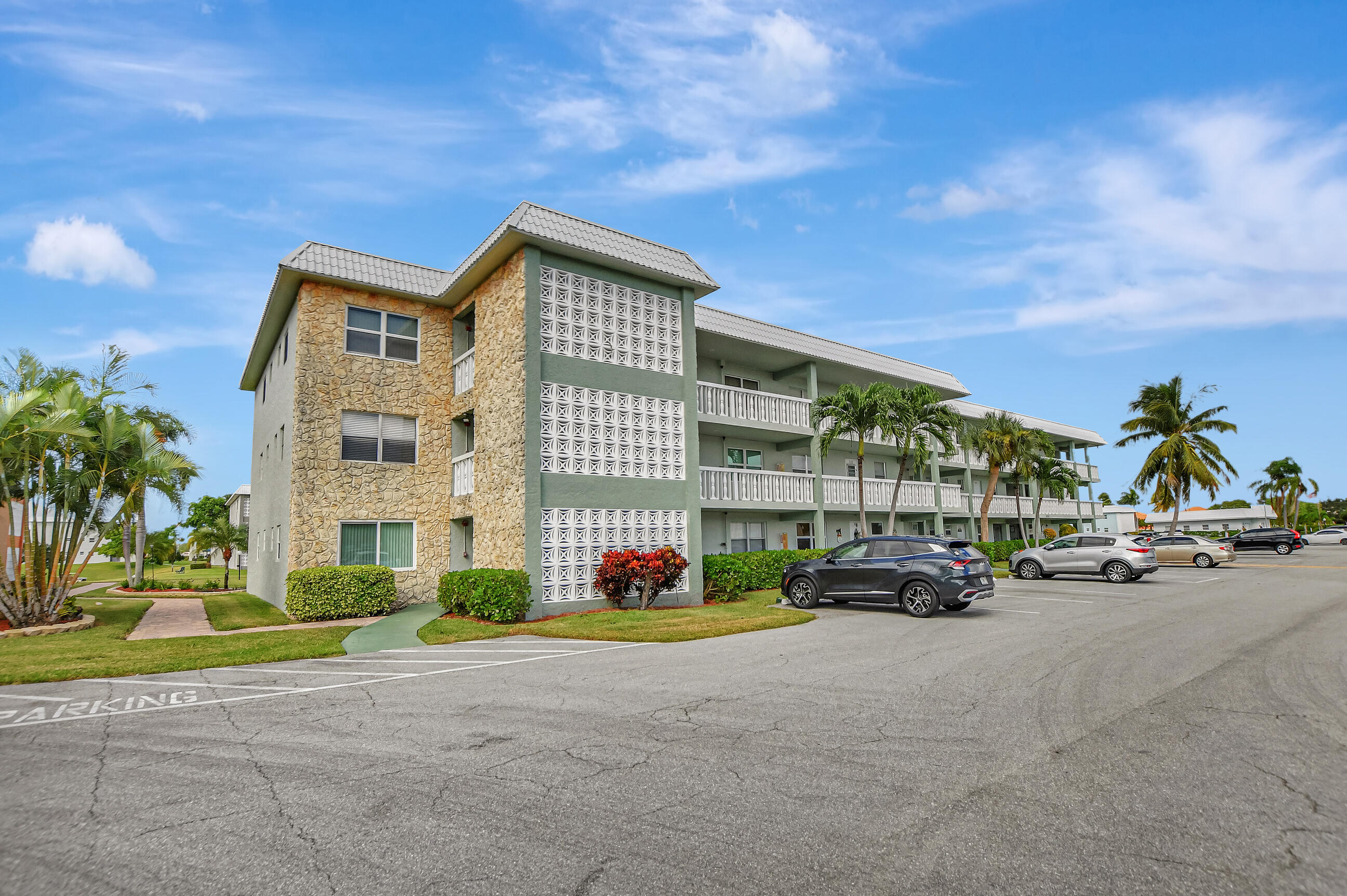 9810 Marina Boulevard, Unit 1120 Boca Raton, FL 33428 - Photo 29 of 29 a parked cars parked in front of a building