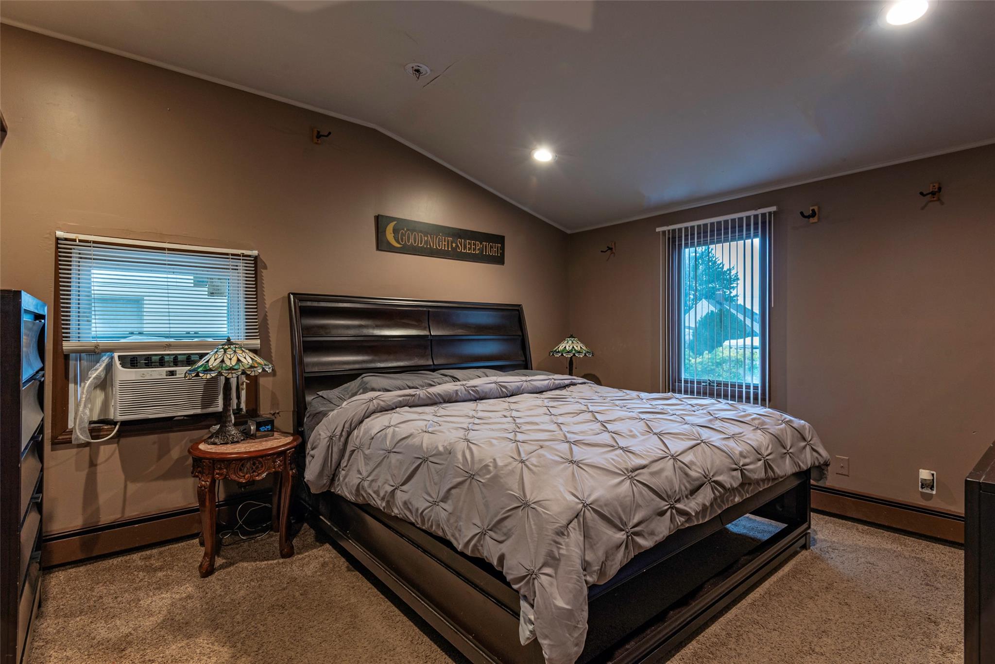 22 Lowland Road Levittown, NY 11756 - Photo 15 of 38 Bedroom featuring carpet flooring, a baseboard heating unit, recessed lighting, lofted ceiling, and multiple windows